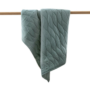 Blue cot quilt; grey cot quilt storm with geometric quilt pattern.