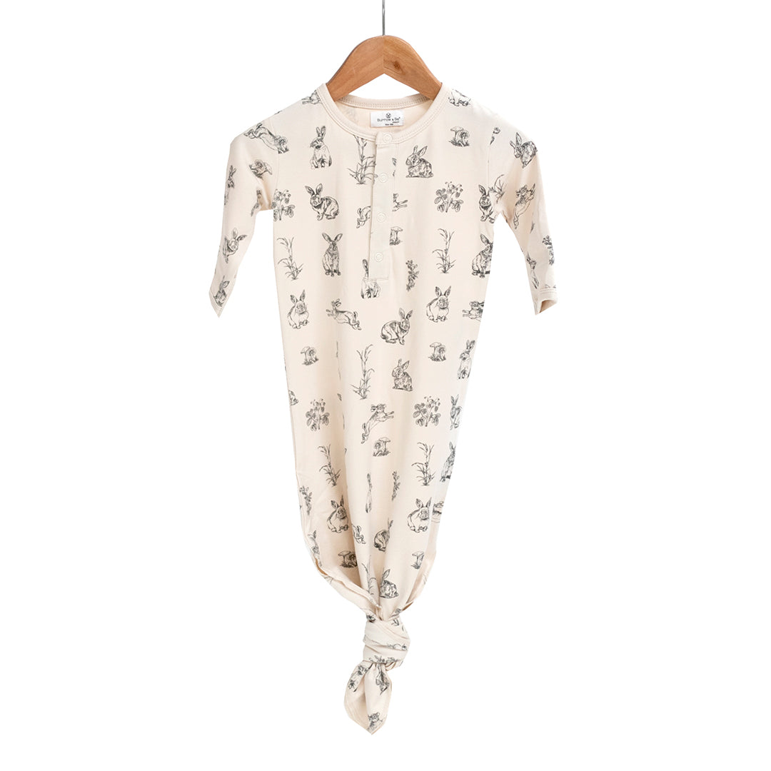 baby sleep gown organic cotton and elastane; natural almond colour with rabbits.