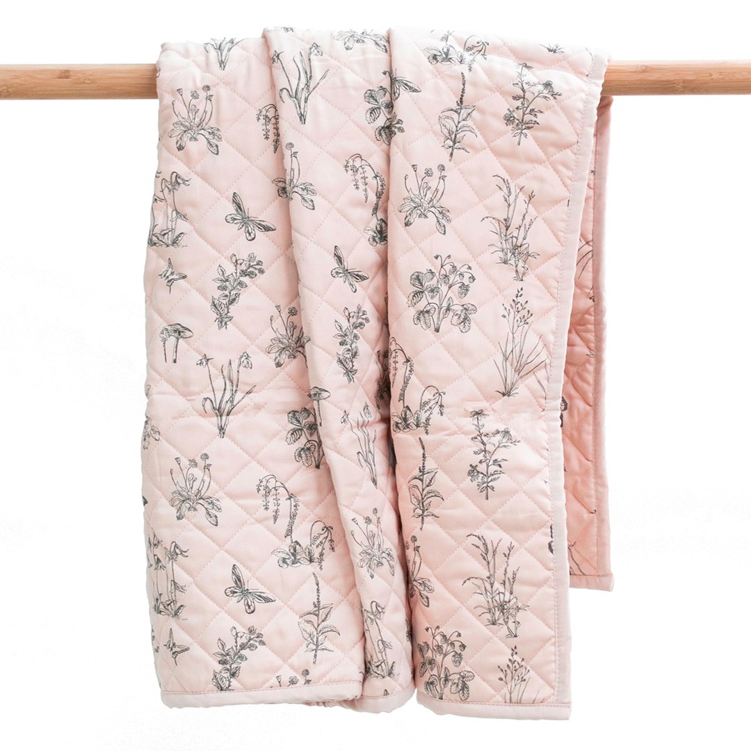 Girls cot quilt floor mat, pink with grey rabbits, diamond quilt pattern.