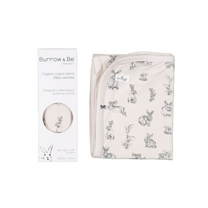 stretchy swaddle in natural almond with rabbit burrower design.