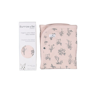 Organic swaddle wrap in blush pink with meadow design. Cotton swaddle wrap gift boxed. Bound edges makes it a good light blanket.