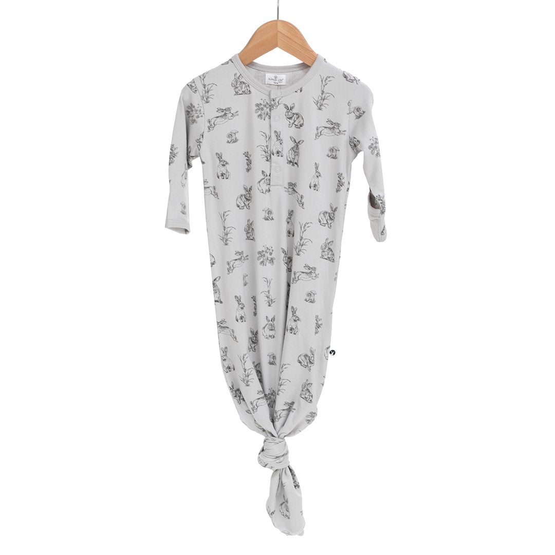 Essentials baby tie bottom gown in grey with rabbit burrowers, long sleeves and tie bottom. Certified organic cotton and elastane.